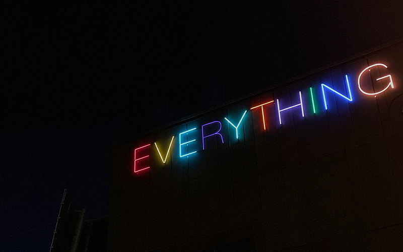 Neon display with the word "EVERYTHING" in various colours